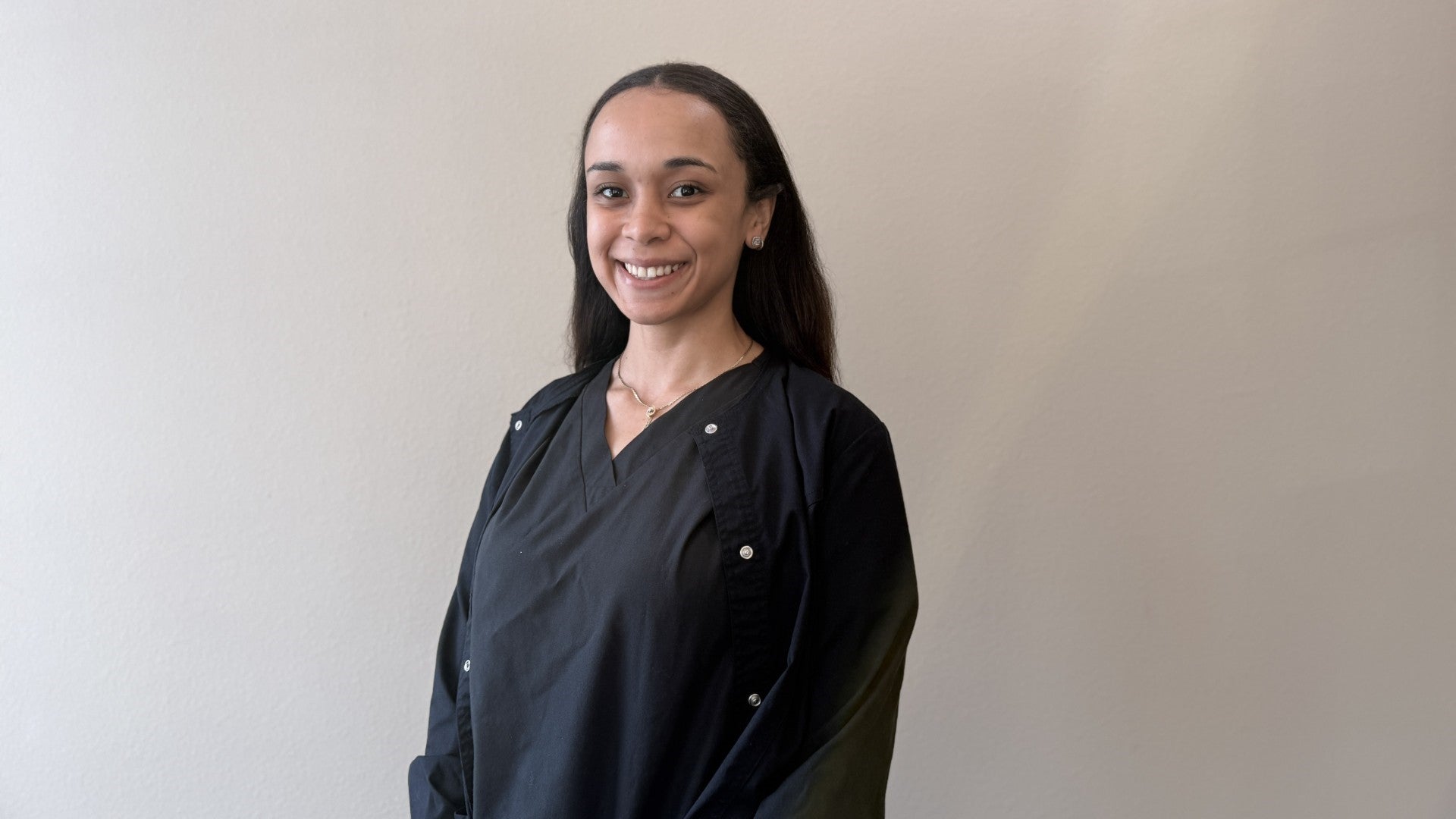 Team member looking at the camera and smiling