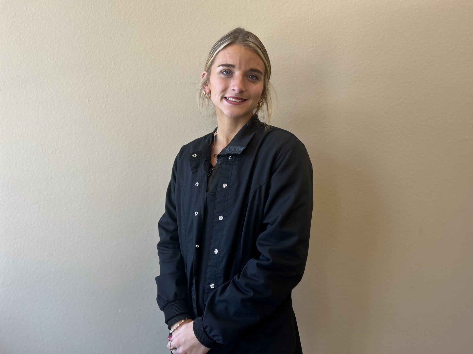 Team member looking at the camera and smiling